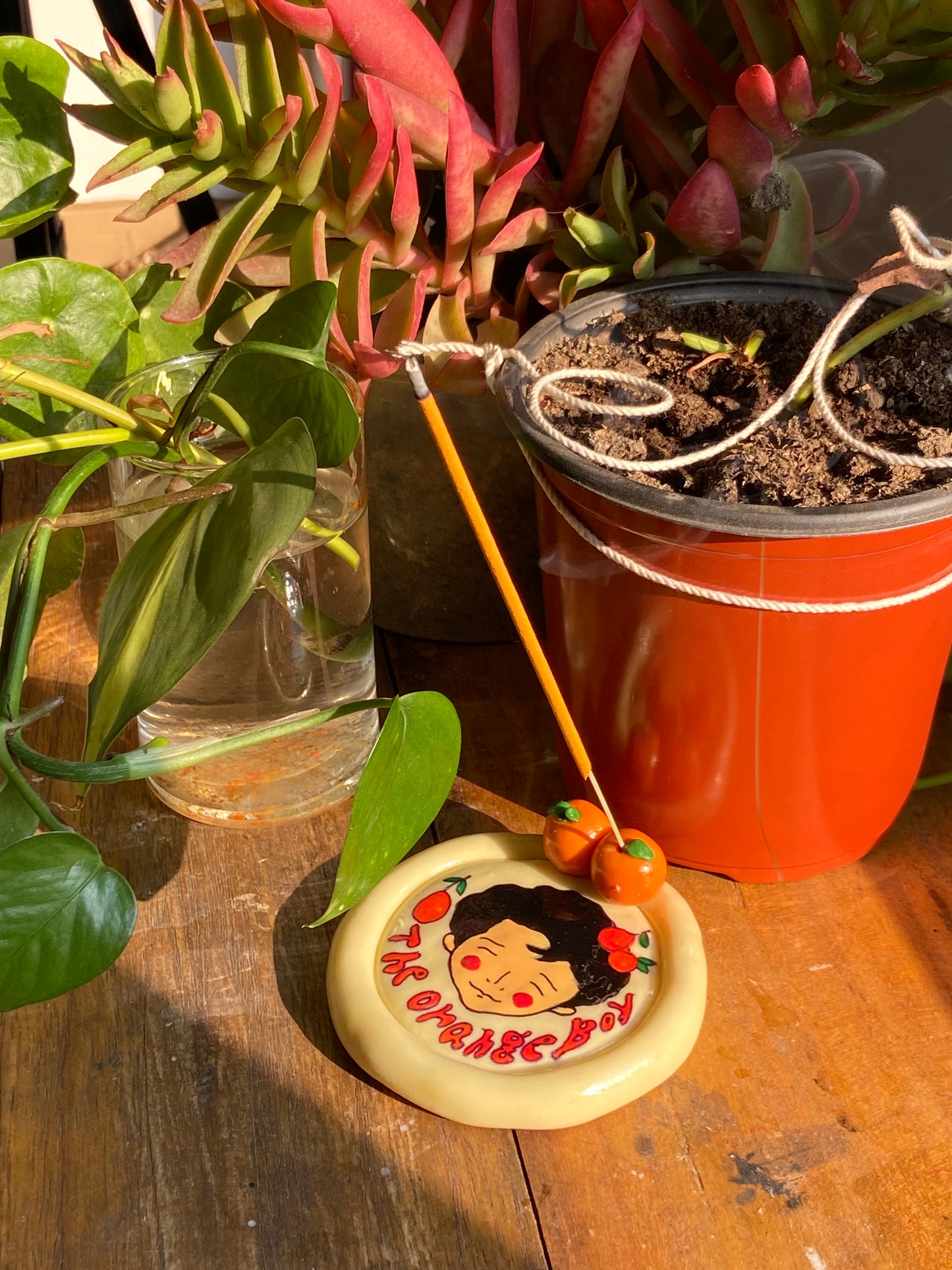 The orange boy trinket dish / incense holder